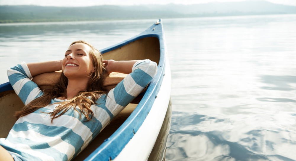Girl relaxing on a wooden boat